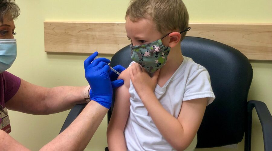 Five-year-old Conley gets his vaccine.