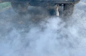 Exhaust from gas-powered car.